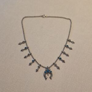 Silver Horseshoe Pendant Necklace with Turquoise Blue Accents